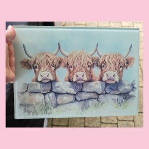Highland Cows Over A Wall Chopping Board